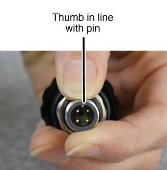 keep your thumb in line with solinst levelvent alignment pin on wellhead