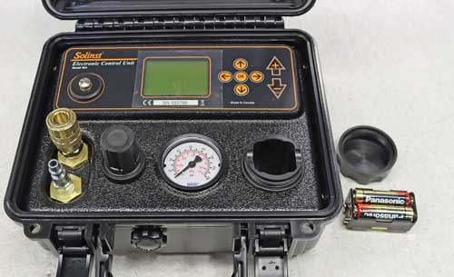 removing the double aa batteries from the solinst model 464 electronic pump control unit