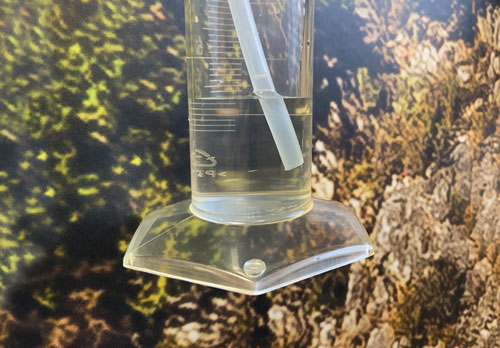 submerge the sample line in a beaker container of water